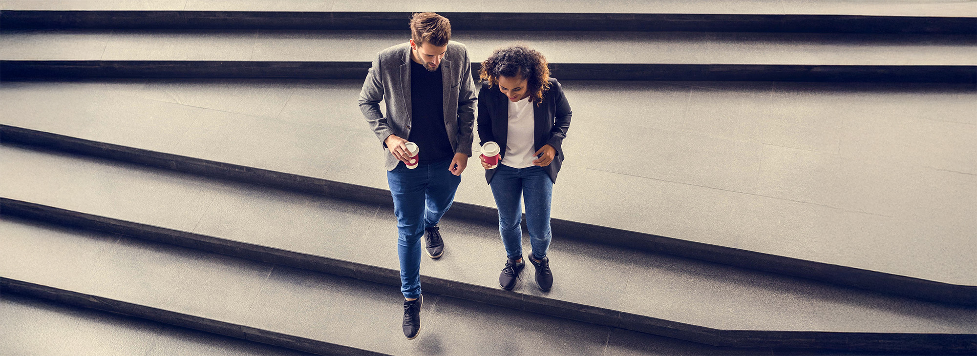 Business partners having take away coffee
