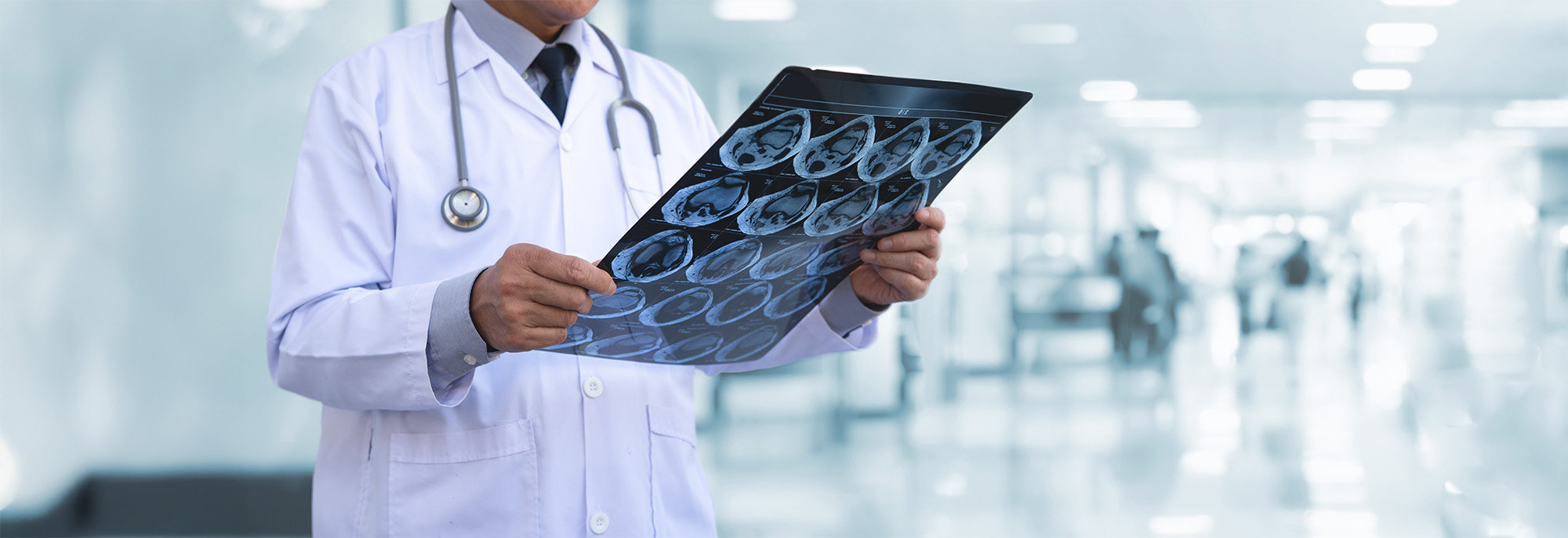 Orthopedic surgeon doctor examining patients knee joint x ray