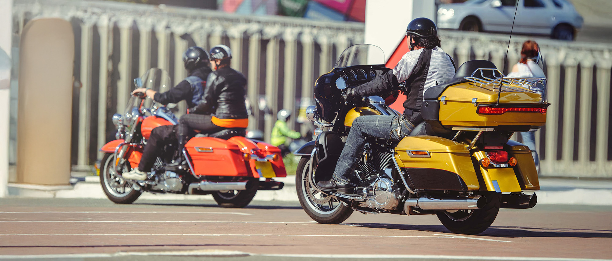 a column of motorcycles ride along the road a motorcycle view from behind a motor tour