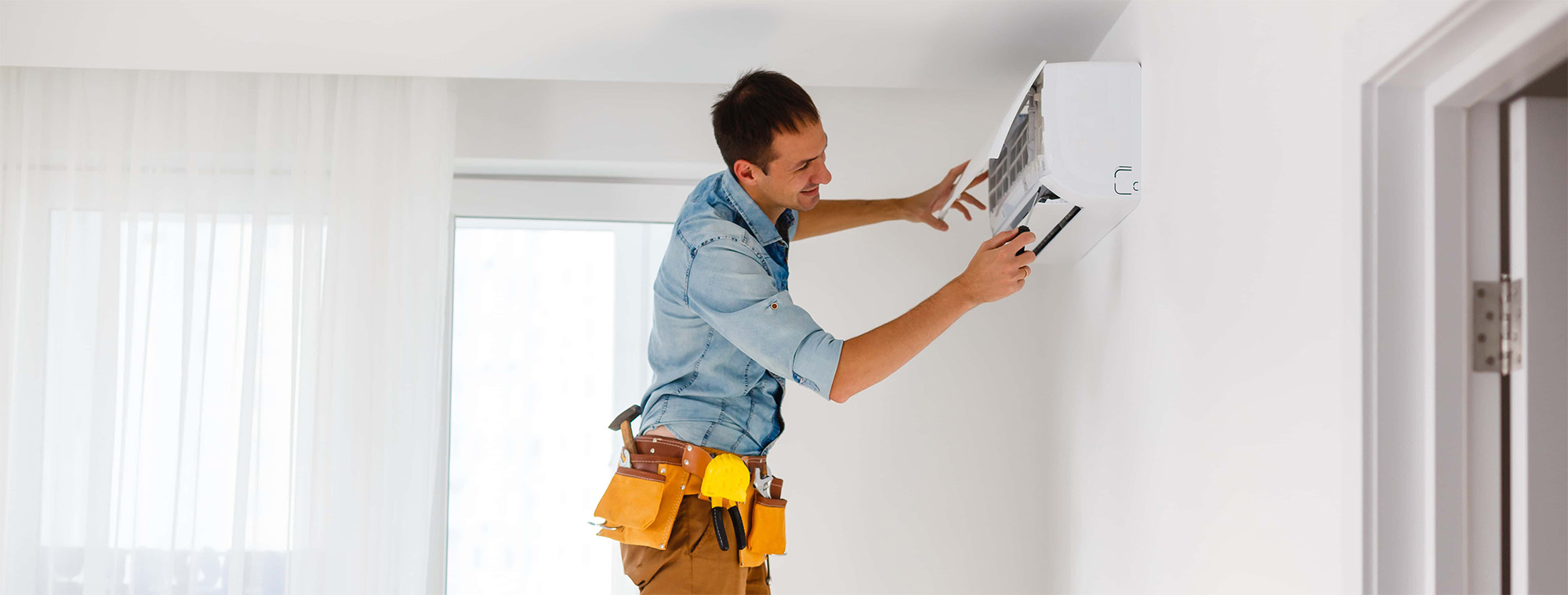 man repair air conditioner