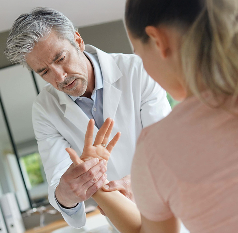 physiotherapist working with patients wrist injury