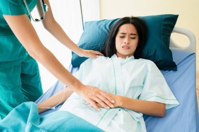 doctor examining patient