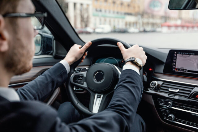 businessman driving car